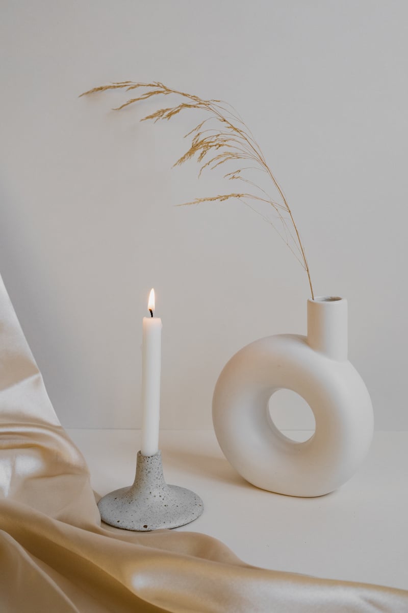 Lighted Candle with White Vase